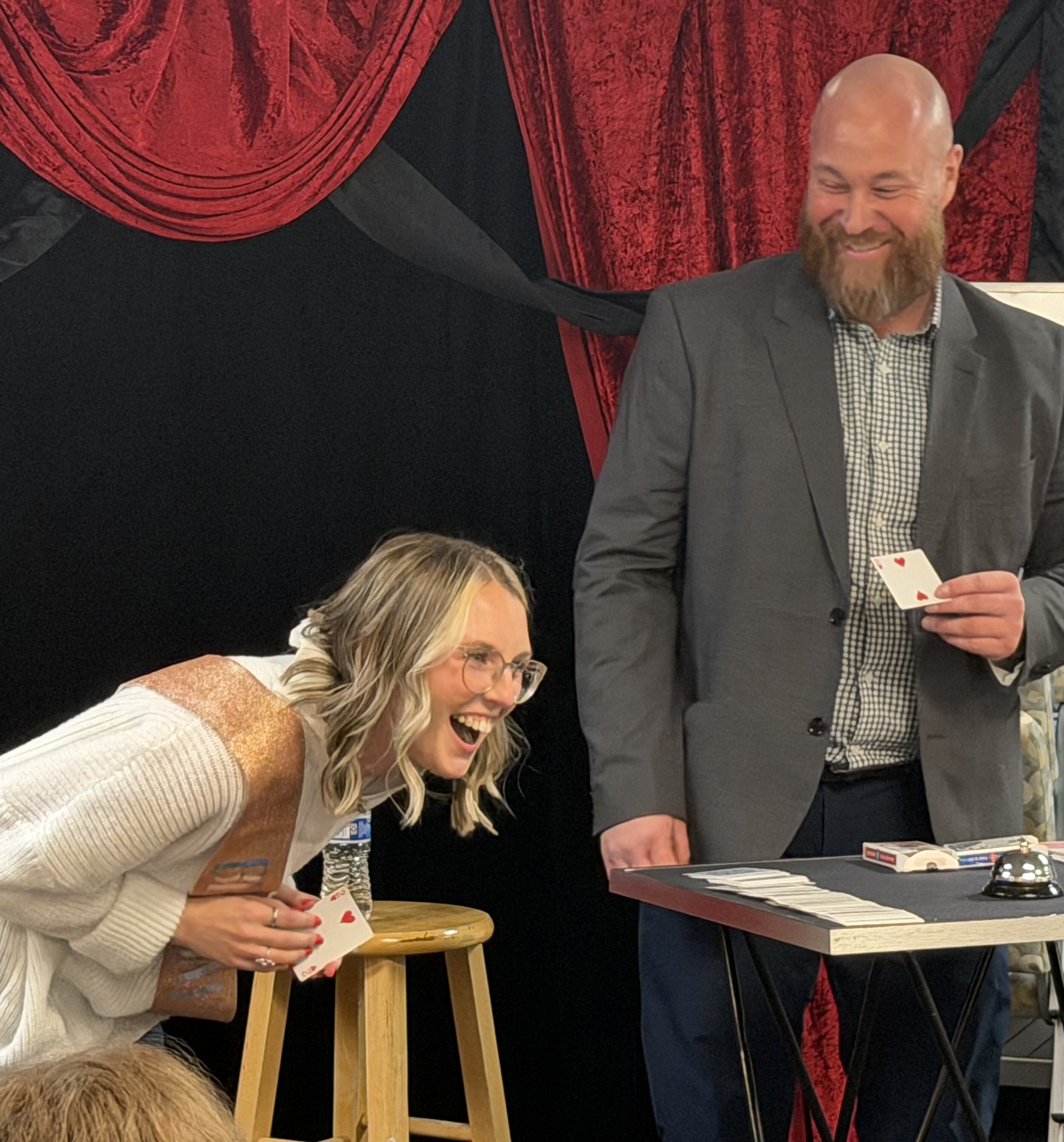 Adam Ryan performing close-up card magic for guests